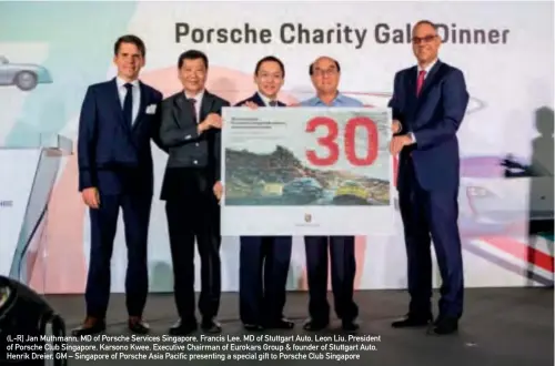  ??  ?? (L-R] Jan Muthmann, MD of Porsche Services Singapore, Francis Lee, MD of Stuttgart Auto, Leon Liu, President of Porsche Club Singapore, Karsono Kwee, Executive Chairman of Eurokars Group &amp; founder of Stuttgart Auto, Henrik Dreier, GM – Singapore of Porsche Asia Pacific presenting a special gift to Porsche Club Singapore