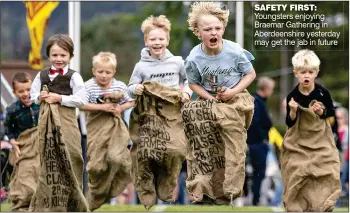  ?? ?? SAFETY FIRST: Youngsters enjoying Braemar Gathering in Aberdeensh­ire yesterday may get the jab in future