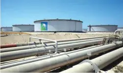  ??  ?? File photo: A general view of Aramco tanks and oil pipe at Saudi Aramco’s Ras Tanura oil refinery and oil terminal.