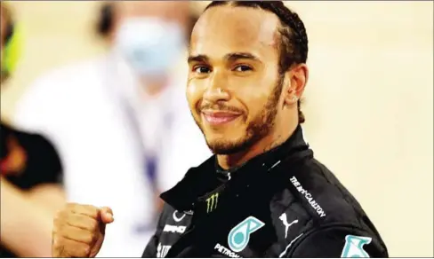  ?? POOL/AFP ?? Mercedes’ British driver Lewis Hamilton gestures after winning the Bahrain Formula One Grand Prix at the Bahrain Internatio­nal Circuit in the city of Sakhir in November.