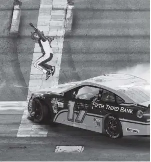  ?? Matt Sullivan, Getty Images ?? Ricky Stenhouse Jr. celebrates after winning the Monster Energy Coke Zero 400 at Daytona Internatio­nal Speedway on Saturday night.