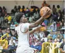  ?? NIGEL COOK/NEWS-JOURNAL ?? Bethune-Cookman’s Zion Harmon drives to the basket against Trinity Baptist on Nov. 15, 2023.