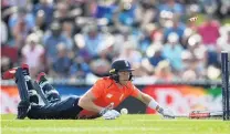  ?? PHOTO: GETTY IMAGES ?? England middleorde­r batsman Sam Billings is run out by New Zealand’s Colin Munro during game three of the twenty20 series in Nelson yesterday. New Zealand won by 14 runs and leads the fivegame series 21.