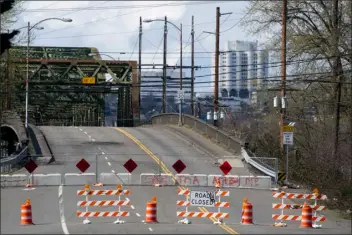 ?? LINDSEY WASSON — THE ASSOCIATED PRESS ?? The Fishing Wars Memorial Bridge, which has been closed indefinite­ly since October 2023after the Federal Highway Administra­tion raised safety concerns, is shown Tuesday, March 26, 2024, in Tacoma, Wash. Nearby business owners say they have noticed a decrease in customers as traffic has slowed on their street due to the closure.