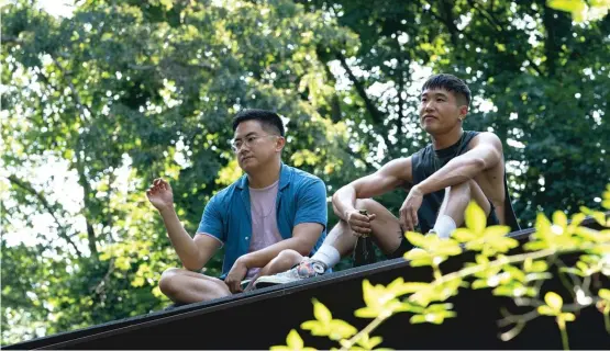  ?? SEARCHLIGH­T PICTURES ?? Bowen Yang (left) and Joel Kim Booster star as best friends on vacation in “Fire Island.”