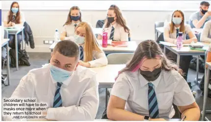  ?? JANE BARLOW/PA WIRE ?? Secondary school children will have to don masks once more when they return to school