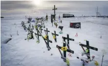  ?? RYAN REMIORZ THE CANADIAN PRESS FILE PHOTO ?? The memorial for the Humboldt Broncos hockey team is seen at the site where 16 people died and 13 were injured when a truck crashed into the team bus on April 6, 2018.