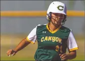  ?? Signal file photo ?? Canyon’s Danielle Rodriguez (21) rounds the bases after hitting a home run in the fourth inning of a Foothill League game between the Hart Indians and the Canyon Cowboys at Canyon High School earlier in the season. The Indians won 15-3.