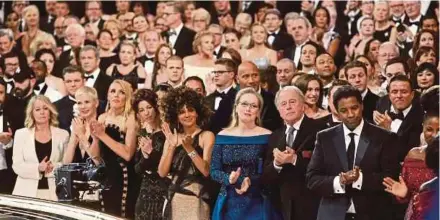  ?? NYT PIC ?? Actors Halle Berry, Dwayne Johnson, Meryl Streep and Denzel Washington at the front row of the Academy Awards in February. If you are in the audience of an award show, clap along and clap really hard. Show that you approve.