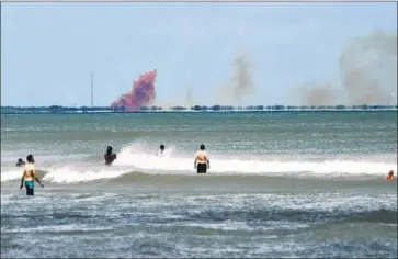  ?? Craig Bailey Florida Today ?? A CLOUD of orange smoke rises from a Crew Dragon capsule that exploded at Cape Canaveral Air Force Station on April 20. Experts at the time said the color was a sign that nitrogen tetroxide was probably involved.