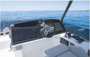  ??  ?? The driving position is good at the flybridge helm and the optional 22in Garmin MFDS are superb, if pricy