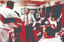  ??  ?? OU coach Billy Tubbs shakes hands with his players in the locker room before a 1990 game in Norman. [OKLAHOMAN ARCHIVES]