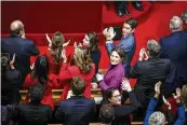  ?? THOMAS PADILLA / AP ?? French Prime Minister Gabriel Attal (right) applauds after lawmakers approved abortion as a constituti­onal right8 Monday.