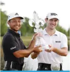  ?? —AFP ?? AVONDALE, Louisiana: Xander Schauffele and Patrick Cantlay pose with the trophy after putting in to win on the 18th green during the final round of the Zurich Classic of New Orleans at TPC Louisiana on April 24, 2022.