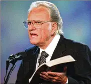  ?? BOB LEVERONE / CHARLOTTE OBSERVER 1996 ?? Evangelist Billy Graham died Wednesday at age 99. He will be buried in a plywood box containing a mattress pad made by Louisiana prisoners, with a wooden cross nailed to the top.