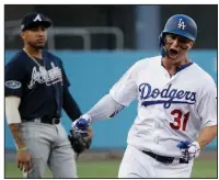  ?? AP/JAE C. HONG ?? Los Angeles left fielder Joc Pederson celebrates his leadoff home run Thursday as he rounds the bases during the Dodgers’ 6-0 victory over the Atlanta Braves in Game 1 of their National League division series at Dodger Stadium in Los Angeles. The home run was Pederson’s only hit of the game.