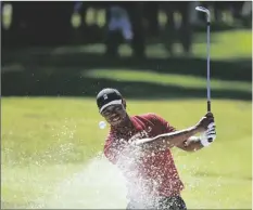  ?? RYAN KANG/AP ?? TIGER WOODS hits out of a greenside bunker on the 17th hole during the final round of the Genesis Invitation­al at Riviera Country Club, Sunday, Feb. 16, 2020, in the Pacific Palisades area of Los Angeles.