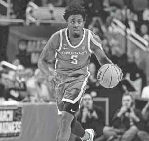  ?? CHARLES LECLAIRE/USA TODAY SPORTS ?? Oregon guard Jermaine Couisnard brings the ball up court during the first half of the win over South Carolina in Pittsburgh on Thursday.