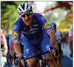  ?? AP/CHRISTOPHE ENA ?? Elia Viviani of Italy crosses the finish line to win Stage 4 of the Tour de France on Tuesday in Nancy, France. It was Viviani’s first Tour stage victory.