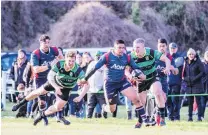  ?? PHOTO: DEBBIE FAHEY ?? On the fly . . . Woodlands back Tavasosi Taimavave goes past a couple of Marist defenders at Centrepoin­t Park on Saturday.