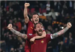  ?? AFP, AP ?? LEFT: AS Roma players celebrate their victory over Barcelona in the Champions League quarter- final second leg match at the Olympic Stadium in Rome on Tuesday. Roma won 3- 0 on the night. RIGHT: Lionel Messi of Barcelona reacts after missing a scoring chance. —