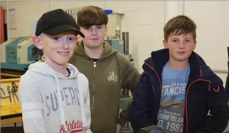  ??  ?? Jake Cadogan, Michael Harler and Richard Whelan checking out the woodwork room at the open night in Colaiste Abbain, Adamstown.