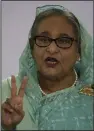  ?? (AP/Altaf Qadri) ?? Bangladesh Prime Minister Sheikh Hasina displays the victory symbol after casting her vote in Dhaka, Bangladesh, on Sunday.