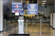  ?? KEITH SRAKOCIC - THE ASSOCIATED PRESS ?? The seats and aisles are empty as seen through the window of the closed Penndot Drivers License Center in Butler, Pa., Friday, April 3.