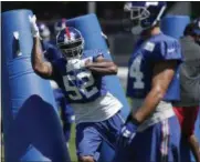  ?? SETH WENIG — ASSOCIATED PRESS ?? Giants’ Jonathan Casillas participat­es in defensive drills on Sunday in East Rutherford, N.J.