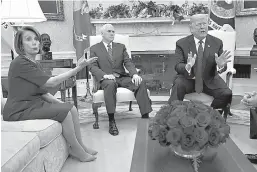  ?? AP Photo/Evan Vucci ?? ■ Vice President Mike Pence, center, looks on as House Minority Leader Rep. Nancy Pelosi, D-Calif., argues with President Donald Trump during a meeting on Tuesday in the Oval Office of the White House in Washington.