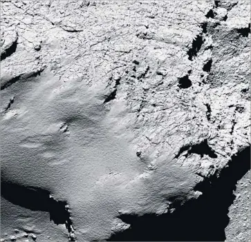  ?? European Space Agency ?? THE ROSETTA orbiter took this image of comet 67P/Churyumov-Gerasimenk­o about 5.5 miles above the surface during its descent. The spacecraft landed a probe on 67P in 2014 and circled the comet for two years.