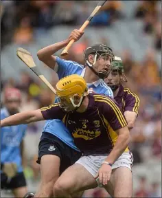  ??  ?? Wexford defenders Darren Byrne and Gary Molloy ensure there’s no way through for Dublin’s Ronan Hayes in the second-half of Sunday’s Electric Ireland Leinster Minor hurling championsh­ip final.