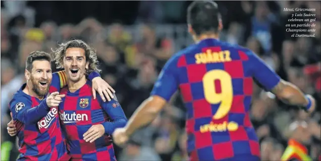  ??  ?? Messi, Griezmann y Luis Suárez celebran un gol en un partido de Champions ante el Dortmund.