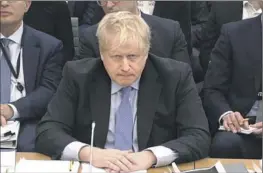  ?? House of Commons ?? BORIS JOHNSON testifies in London on Wednesday. If a parliament­ary panel concludes he lied deliberate­ly, he could lose his seat in the House of Commons.