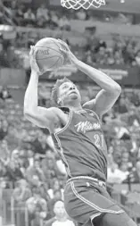  ?? JOEL AUERBACH/AP ?? Heat center Hassan Whiteside goes to the basket against the Boston Celtics. Whiteside has worked hard at the foul line during practice this season, but has not realized desired results during games.