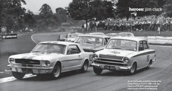  ??  ?? An all-Ford battle at the first corner of the Crystal Palace circuit in 1965, with Jim Clark (in JTW 497C) attempting to go round Jackie Oliver’s Ford Mustang.