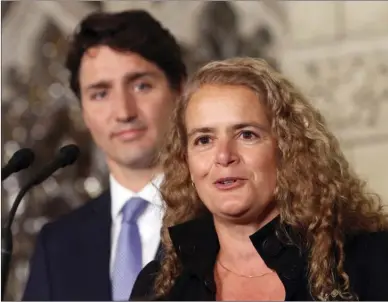  ??  ?? Prime Minister Justin Trudeau looks on as governor general designate Julie Payette talks to reporters July 13 on Parliament Hill in Ottawa.