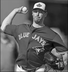  ?? CP PHOTO ?? John Axford was struggling through single-a in 2009 when the Milwaukee Brewers made a suggestion that changed his career path.