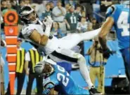  ?? MIKE MCCARN - AP ?? The Philadelph­ia Eagles’ Zach Ertz (86) catches a touchdown pass as the Carolina Panthers’ Mike Adams (29) defends in the second half of an NFL football game in Charlotte, N.C.