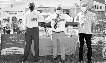  ?? CONTRIBUTE­D ?? From left: Deputy CEO of Manpower & Maintenanc­e Services Garth Hinchcliff­e, Southern Regional Health Authority Regional Director Michael Bent, and board Chairman Wayne Chen after the handover of $350,000.00 worth of PPEs to the Mandeville Regional Hospital on Wednesday by Manpower & Maintenanc­e Services.