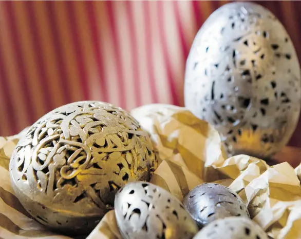  ?? JENELLE SCHNEIDER/PNG ?? The chocolate Easter eggs at Chocolater­ie de la Nouvelle France are dusted with gold and silver, reminiscen­t of the Faberge eggs collected by Russian royalty.