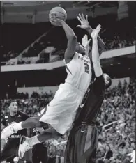  ??  ?? Arkansas Democrat-Gazette/MELISSA SUE GERRITS
Arkansas forward Alandise Harris
attempts a layup against South Alabama’s Austin Karazsia on Saturday night.