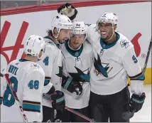  ?? RYAN REMIORZ – THE CANADIAN PRESS VIA AP ?? From left, the Sharks’ Tomas Hertl, Brenden Dillon, Kevin Labanc and Evander Kane celebrate Labanc’s goal against the Canadiens.