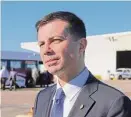  ?? Courtney Pedersen/The Enterprise ?? Pete Buttigieg visited the Port of Port Arthur on Feb. 9. The new White House plan will make 7,500 chargers available to non-Tesla EVs.