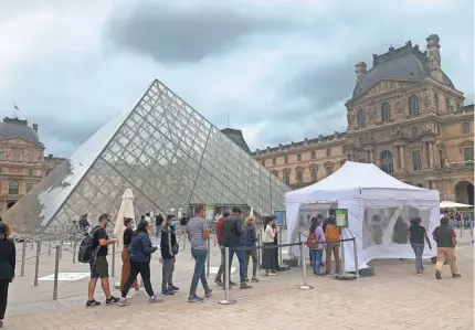  ?? KATIE JACKSON/SPECIAL TO USA TODAY ?? COVID-19 has cut down the crowds typically seen at tourist meccas including the Louvre in Paris this summer.