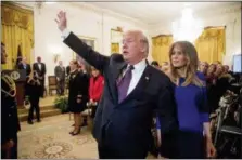  ?? ANDREW HARNIK — THE ASSOCIATED PRESS ?? First lady Melania Trump walks with President Donald Trump as they leave a Medal of Freedom ceremony Friday in the East Room of the White House in Washington.