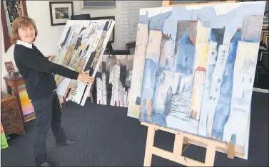  ??  ?? NEW COLLECTION: Artist Amabile Dalfarra-smith prepares her work to be displayed in Horsham’s Art is... festival’s Galleries on the Side at Framewave Picture Framing in Horsham. Picture: PAUL CARRACHER