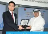  ??  ?? CEO of Huawei Technologi­es in Kuwait, Trevor Liu honors Mohammed Yousif Yacoub, Assistant Director General for Business Developmen­t at KDIPA