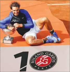  ?? AP PHOTO ?? Rafael Nadal poses with the French Open men’s singles trophy after defeating Stan Wawrinka in yesterday’s final.