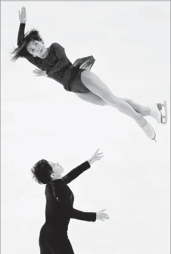  ?? CHRIS CARLSON / AP ?? Sui Wenjing and Han Cong perform during the pairs free skate competitio­n at the Four Continents Figure Skating Championsh­ips on Saturday in Anaheim, California.